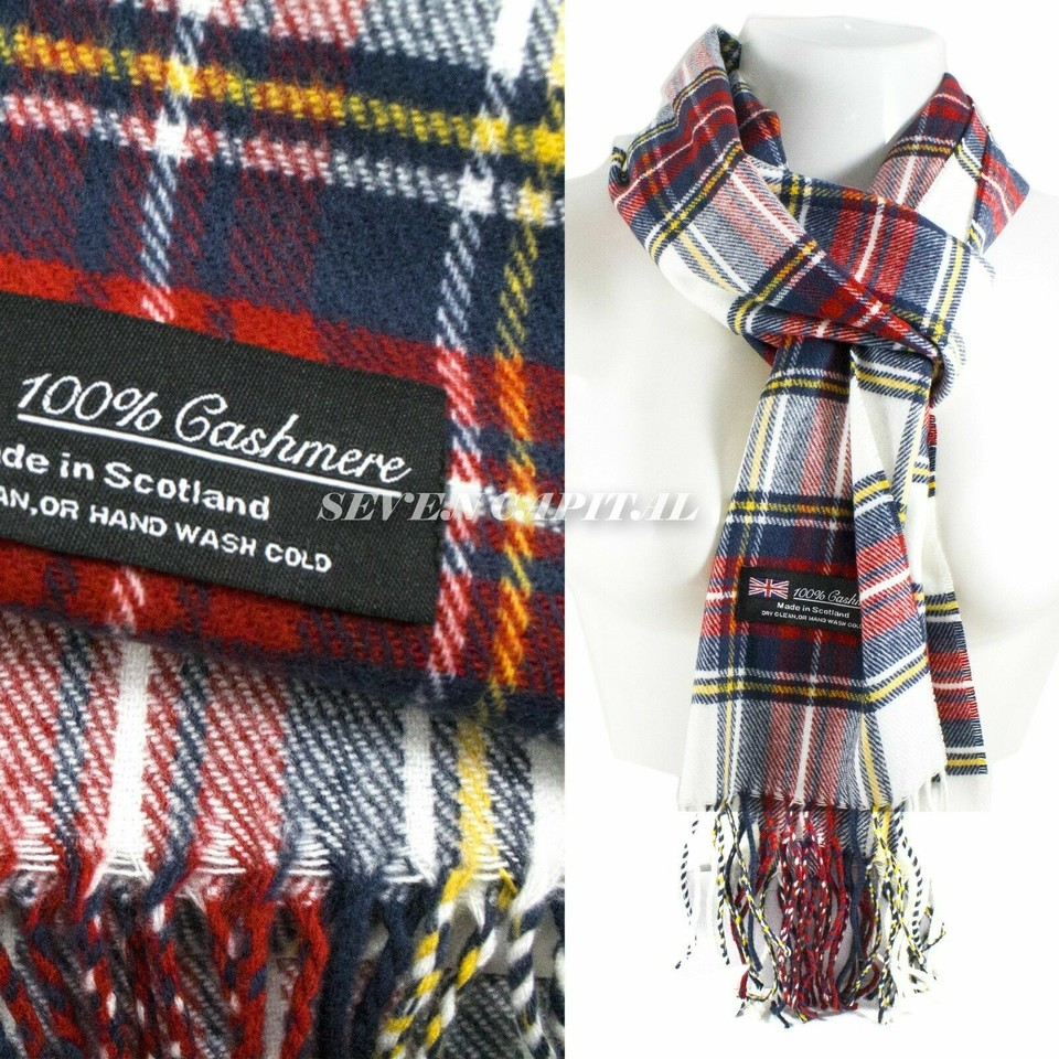 Plaid cashmere scarf with label indicating 100% cashmere and made in Scotland.
