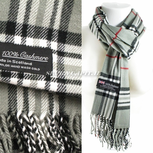 Two plaid scarves with labels indicating cashmere and Scottish origin on a white background.