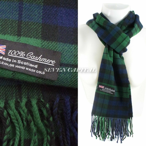 Green and blue plaid cashmere scarf with a label on a white background