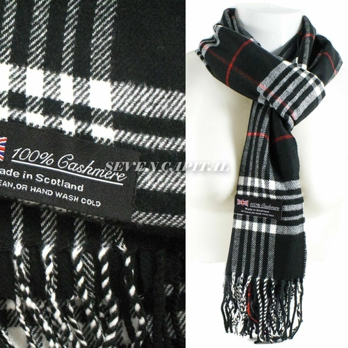 Black and white plaid cashmere scarf with brand label on a white background