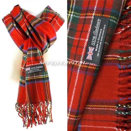 Red plaid scarf with visible brand label on a white background