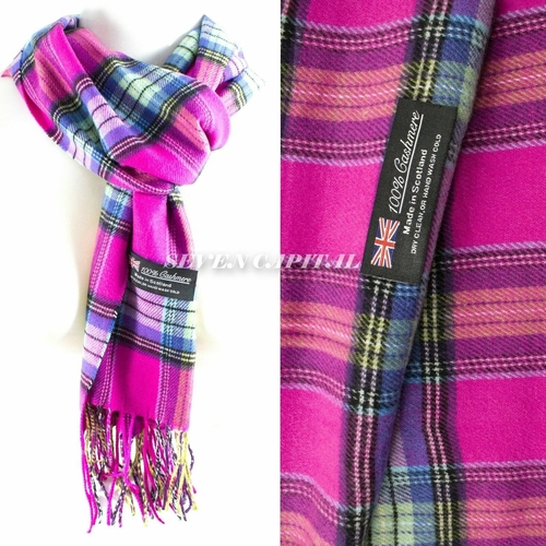 Plaid scarf with pink and purple hues and visible brand label on a white background