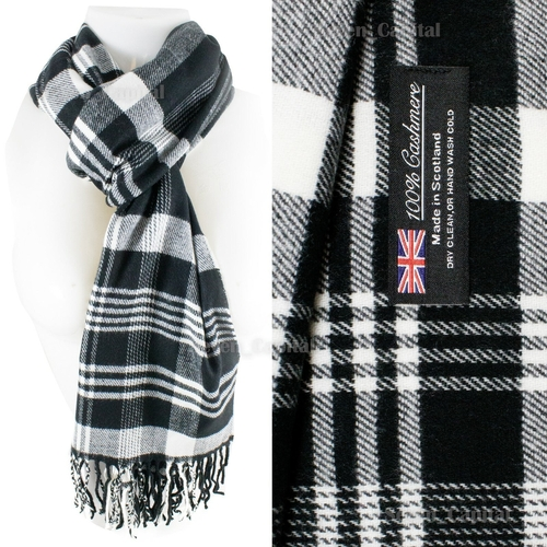 Black and white plaid scarf with a label on a white background