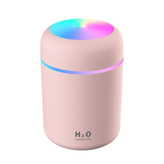 A pink cylindrical humidifier with a glowing multicolor LED light on top and a thin blue and purple light band around the middle, on a white background.