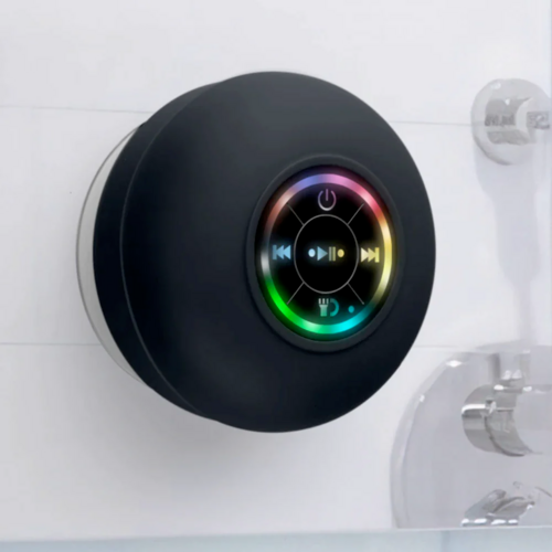 Black round device with colorful display on a white background