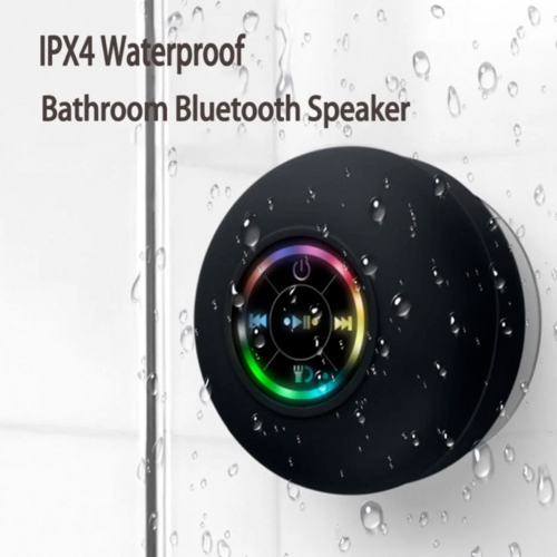Black bathroom Bluetooth speaker with colorful display on a wet surface background