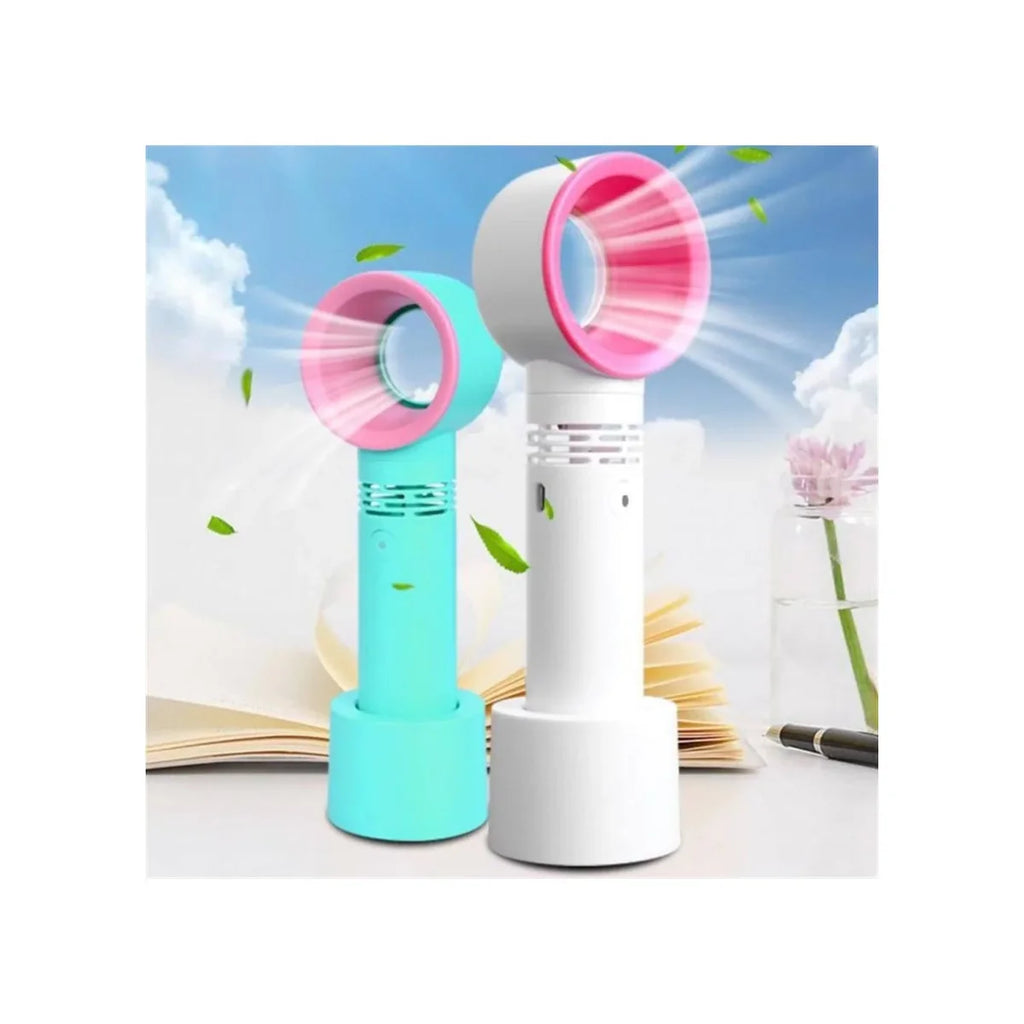 Two portable cooling fans shown side by side against a sky-and-cloud backdrop with leaves floating around. One fan is light aqua/turquoise with a pink circular grille, and the other is white with a pink circular grille.