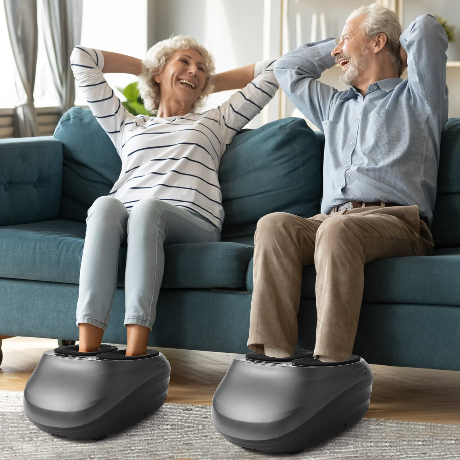 Two people using foot massagers on a couch in a living room setting.