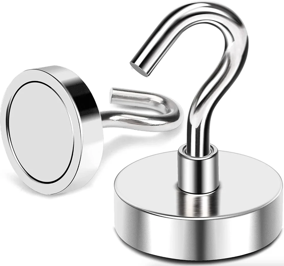 Silver magnetic hook and magnet on a white background