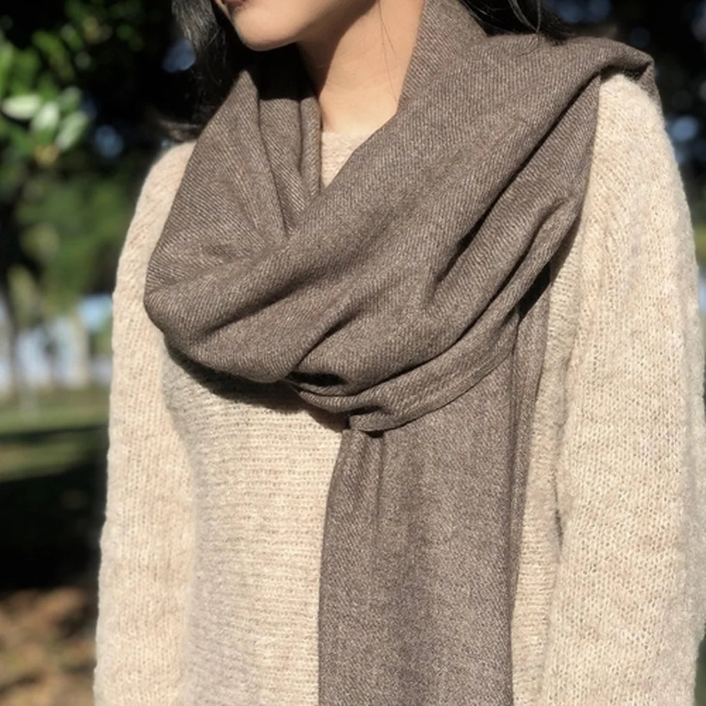 Lady wearing an espresso colored scarf.