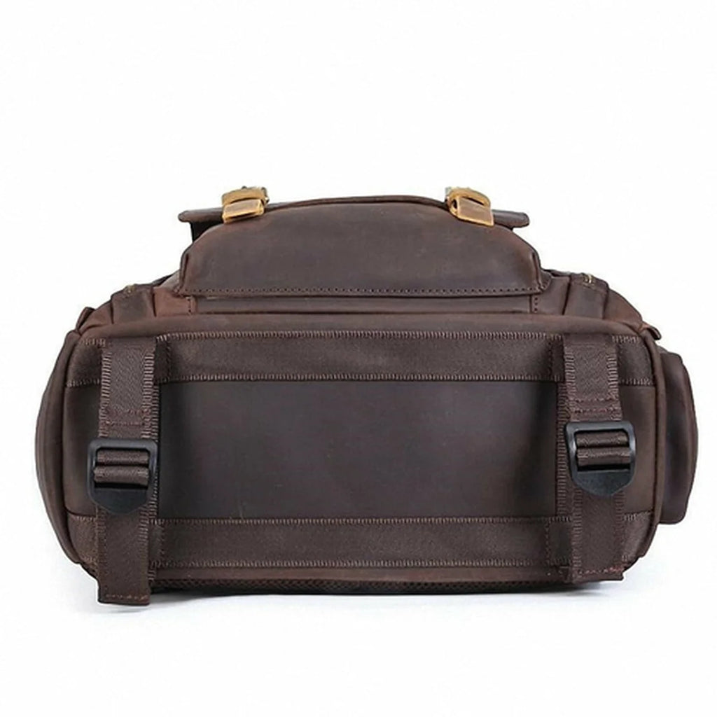 Brown leather bag with gold accents on a white background