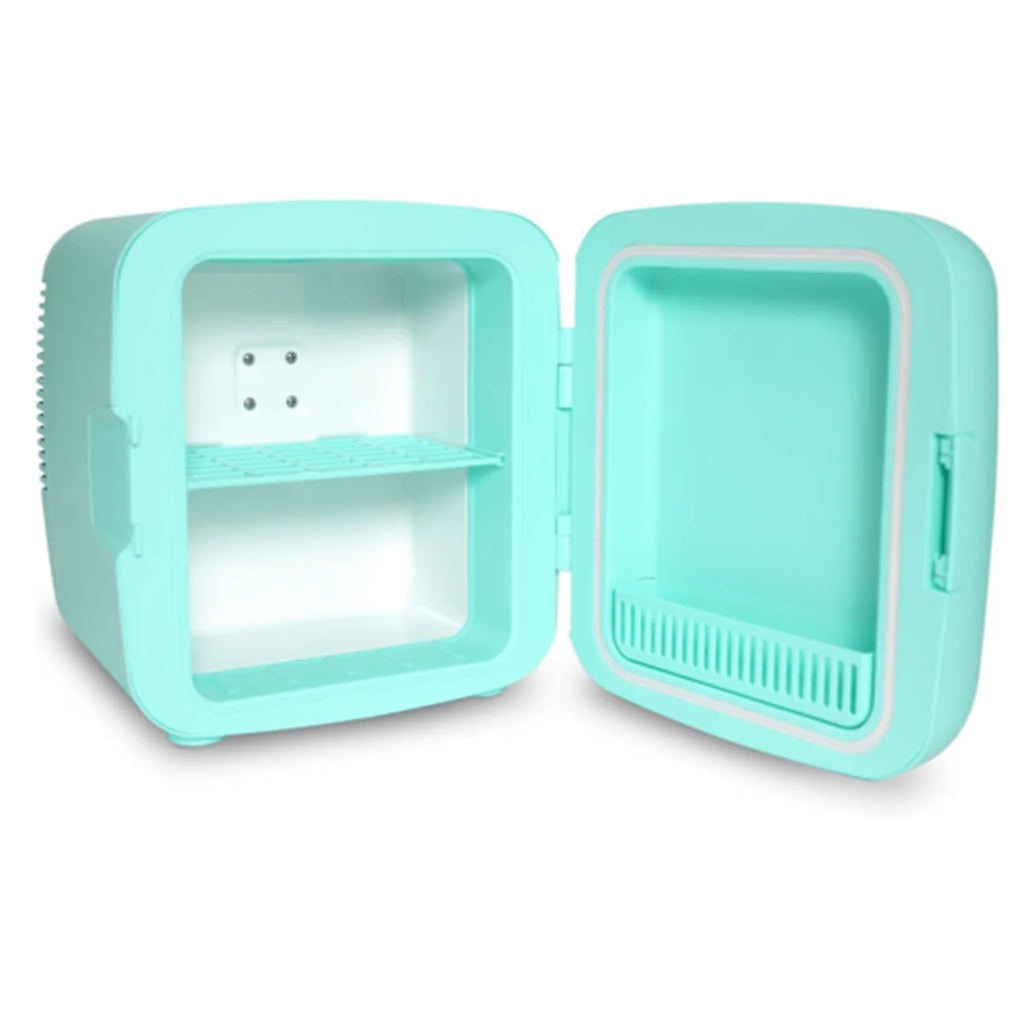 A compact, portable mini refrigerator in mint green, shown with its door open to reveal a single interior shelf and a small door storage compartment.