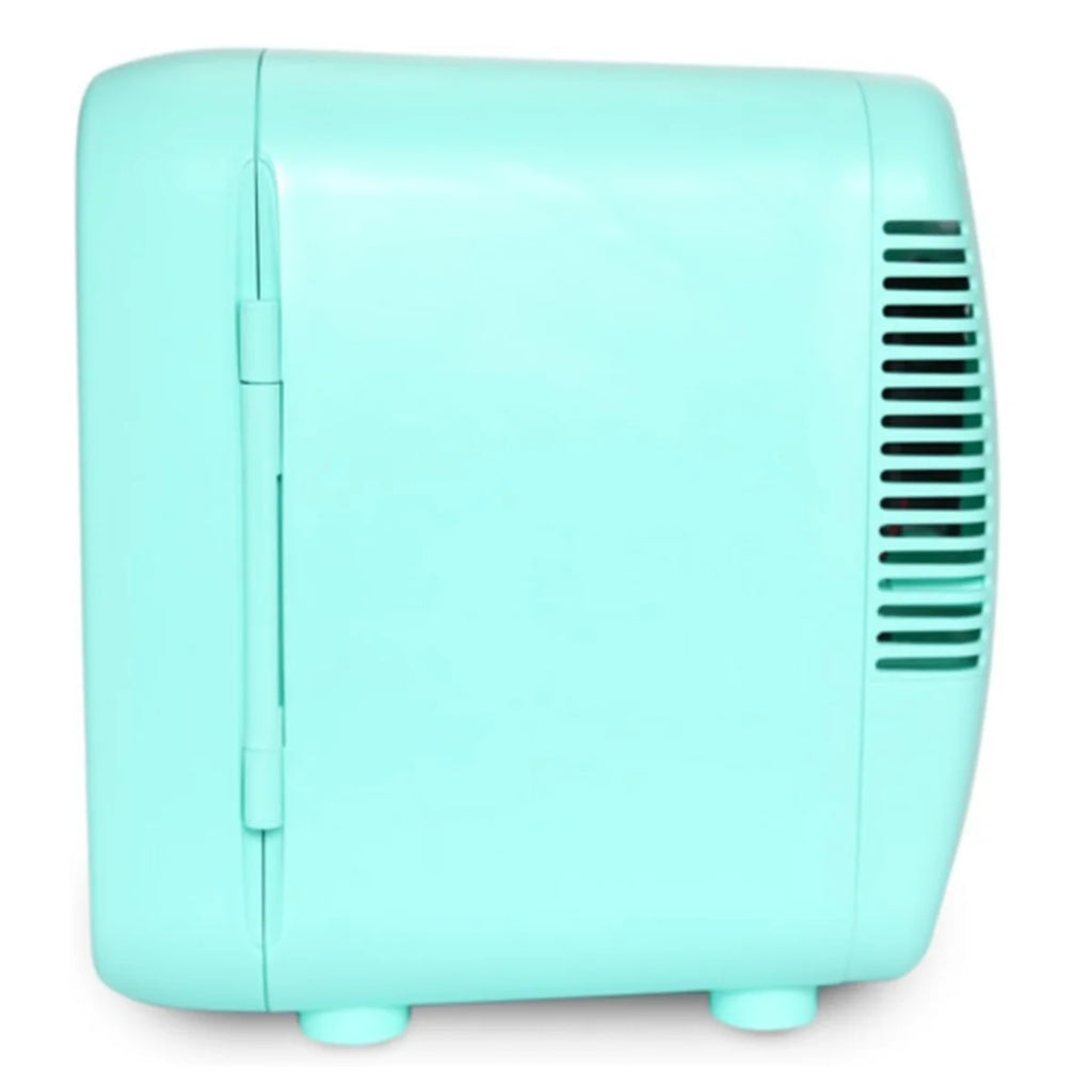 Turquoise mini refrigerator on a white background