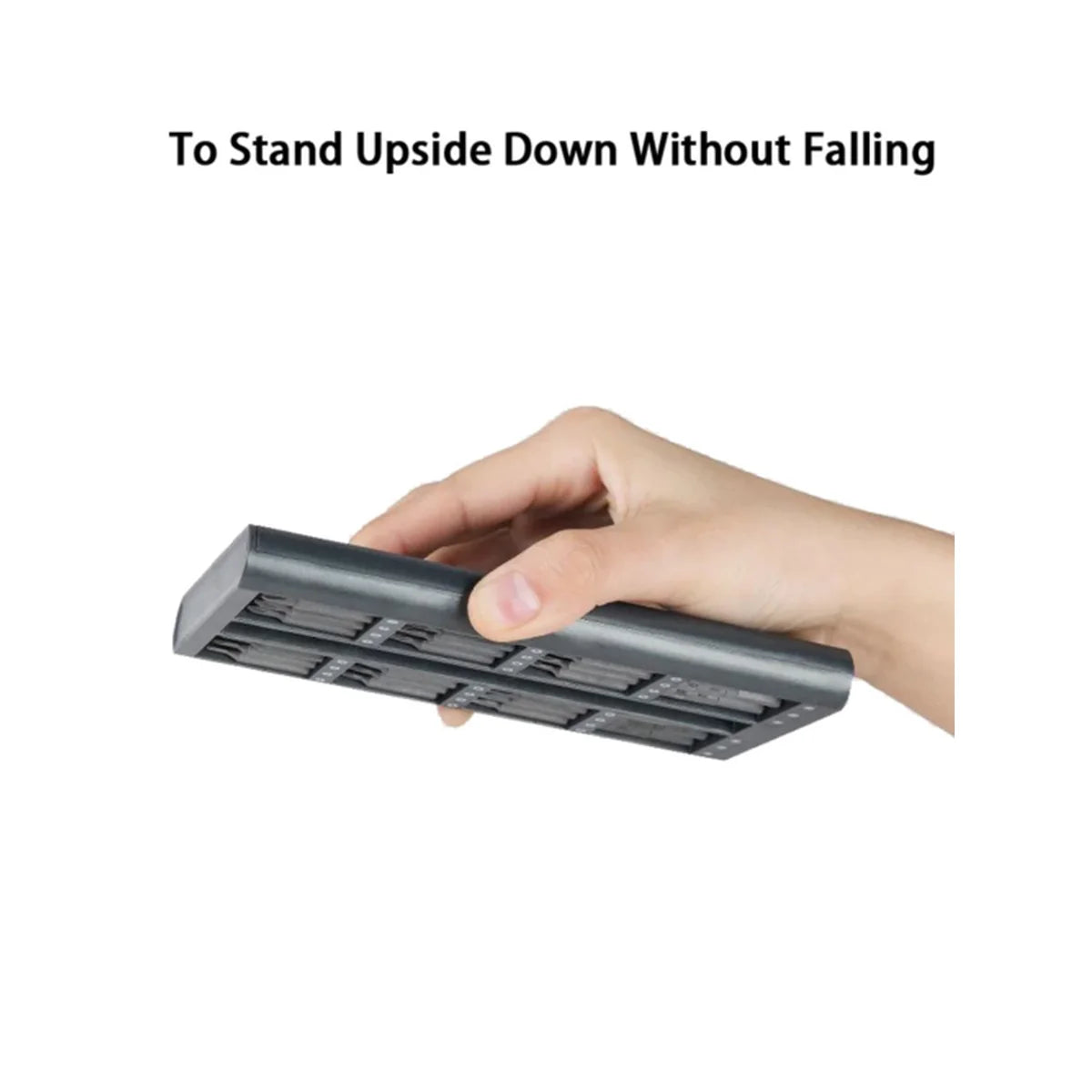 A hand holding a dark gray rectangular electronic battery or adapter, with the text 'To Stand Upside Down Without Falling' above on a plain white background.