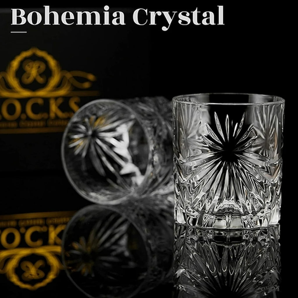 Crystal glass with intricate design on a reflective surface, featuring the brand 'Bohemia Crystal'.