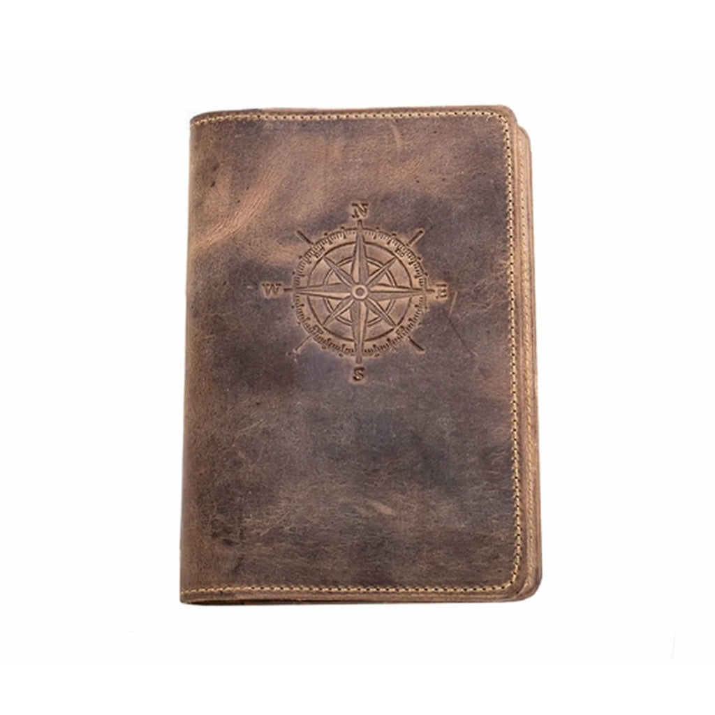 A brown distressed leather folio or notebook cover featuring an embossed compass rose design on the front, shown against a plain white background.