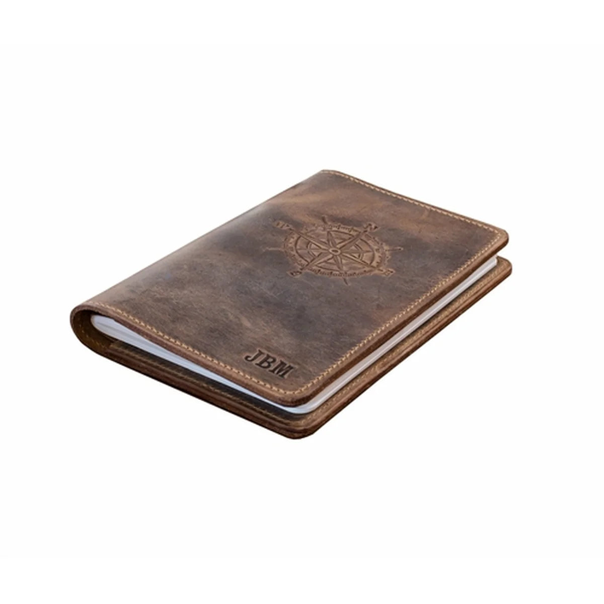 A brown leather passport cover with an embossed compass rose design and the initials 'JBM' on the front, shown on a plain white background.
