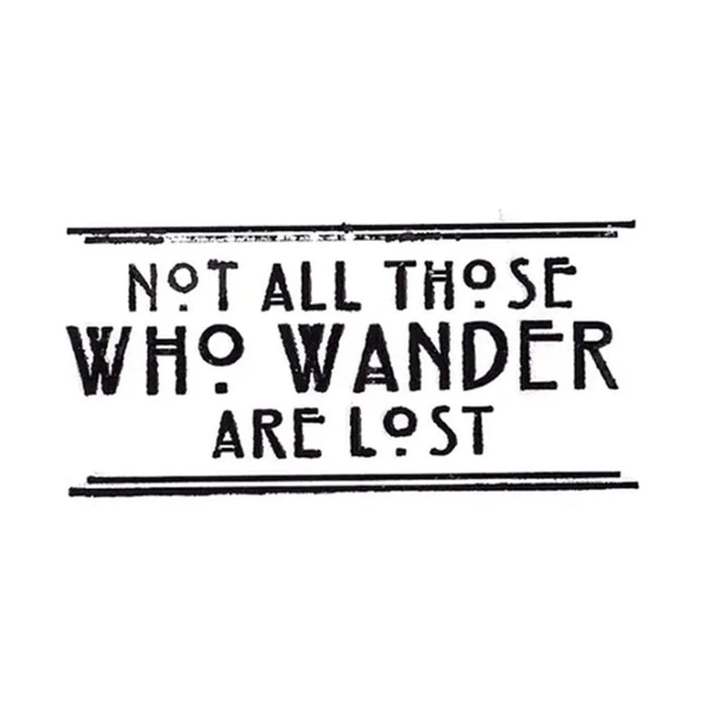 Text 'Not all those who wander are lost' on a white background
