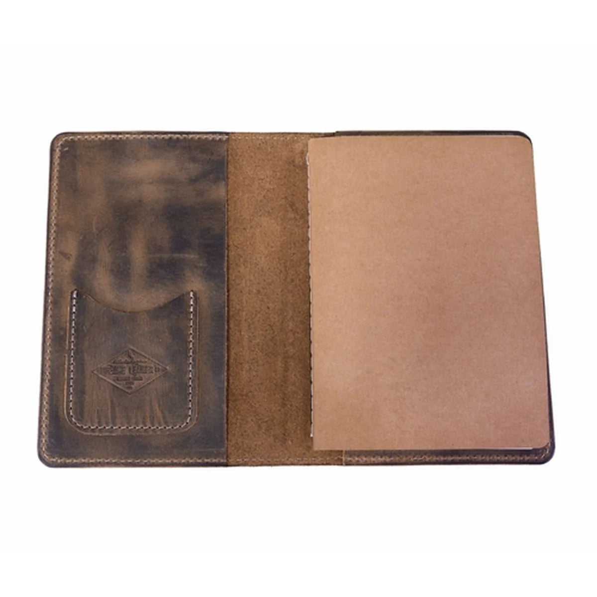 An open brown leather notebook cover or passport holder, showing a dark brown textured pocket with an embossed logo on the left and a tan interior page on the right, isolated on a white background.
