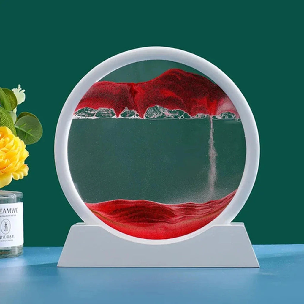 Circular decorative piece with red fabric and water on a stand, next to a yellow flower and a bottle.