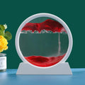 Circular decorative piece with red fabric and water on a stand, next to a yellow flower and a bottle.